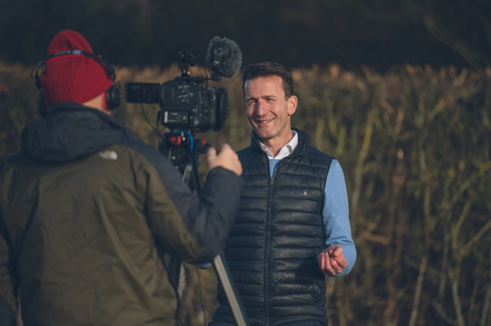 Guy Thompson in front of a camera